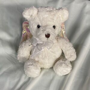 Adorable fluffy white bear with iridescent wings